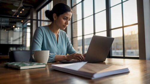 Professional using laptop for digital onboarding